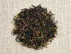 Golden Yunnan Superior musta tee. Lähikuva lehdistä. Luomu
